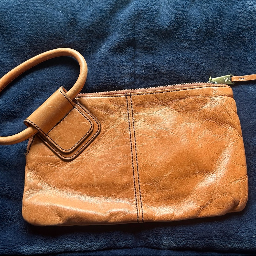 Classic HOBO Sable leather wristlet. Orange. Soft, genuine leather.